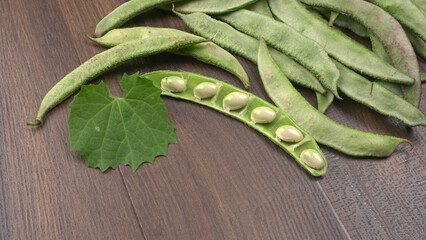 Pile of green beans over wooden background, Healthy food concept