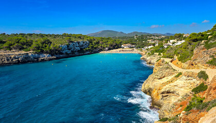 Cala Romantica beach view panorama with blue sky in summer