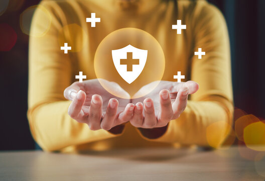 Health insurance and medical welfare concept. Hand with plus sign and medical icons, health and access to healthcare Get people interested in health care