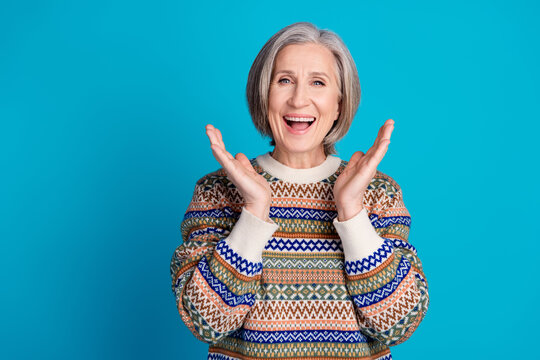 Portrait of impressed senior person with bob hair wear ornament pullover staring at ubelievable sale isolated on blue color background