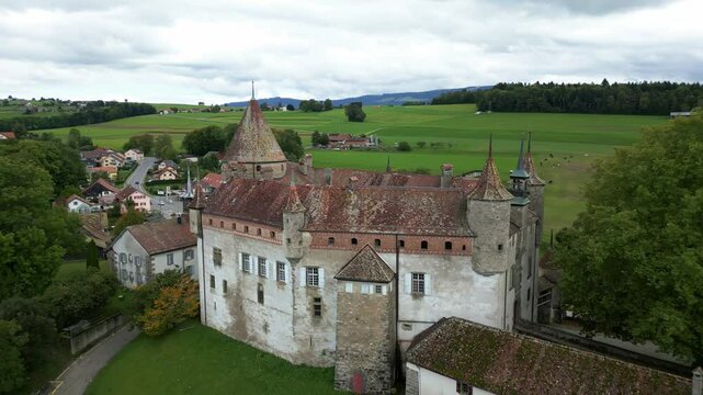 Dolly out drone shot of beautiful Oron Castle in Vaud Switzerland