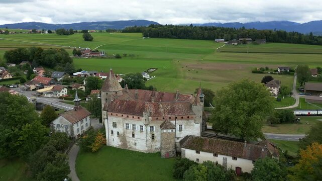Establishing drone shot of beautiful Oron Castle in Vaud Switzerland