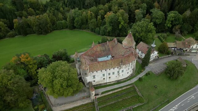 Parallax drone shot right above magnificent Oron Castle in Vaud Switzerland