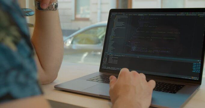 Close up Man coding html and programming on screen Monitors, development web, developer.