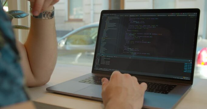 Close up Man coding html and programming on screen Monitors, development web, developer.