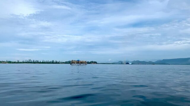 view from a distance of an island with the shape of a tablespoon