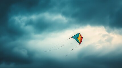 A colorful kite flies in a stormy sky with dark clouds.
