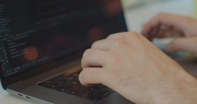 Closeup coding on screen, Man hands coding html and programming on screen laptop, development web, developer.