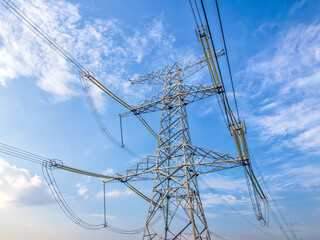 High voltage electricity towers on a sunny day
