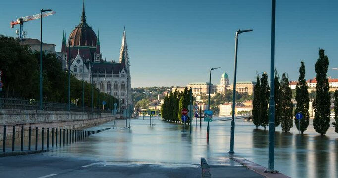 Budapest, Hungary - September 22, 2024: Rising Waters Flood the Highway Outside Budapest's Parliament in the Aftermath of Storm 'Boris'. Timelapse. Early morning.