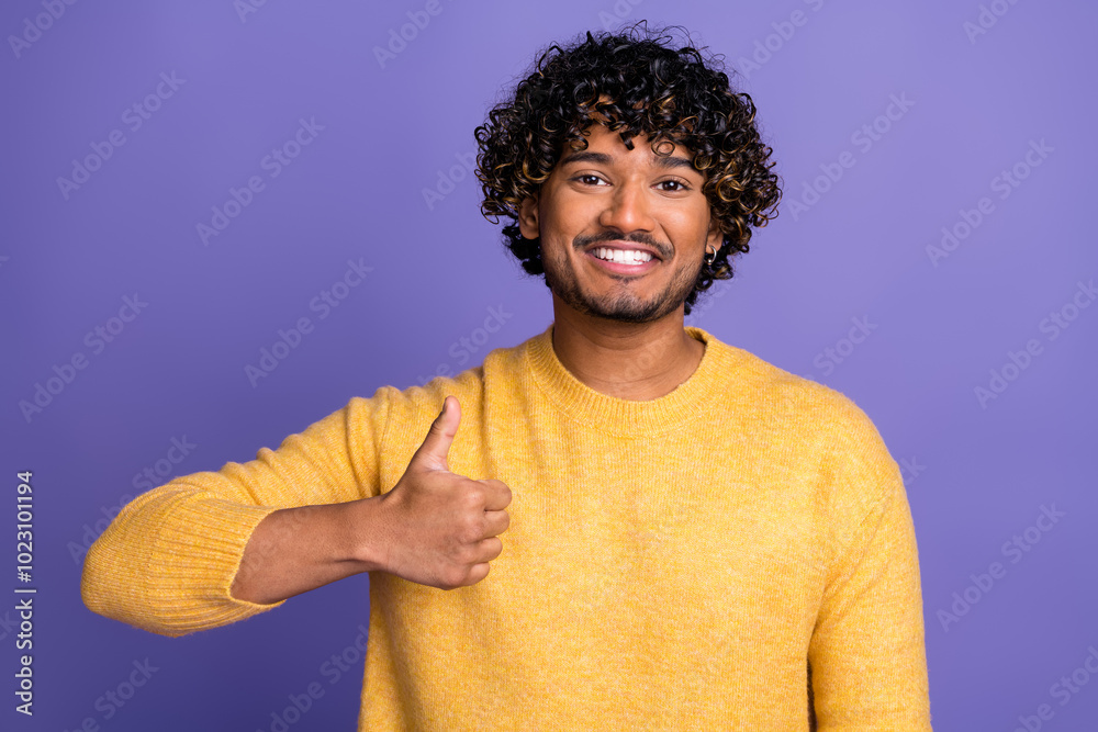 Poster Photo of glad satisfied man wear trendy yellow clothes thumb up isolated on violet color background