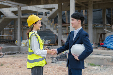 Team architects workers, men and women, join hands to join forces to join forces to work for the industry for success. Teamwork and professional colleagues : Workers' hands, teamwork concept.