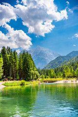 Slovenia, vertical picturesque view of beautiful lake Jasna and Alps mountains. High quality photo