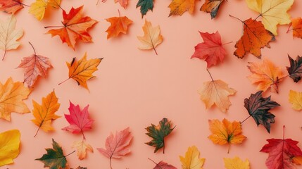Autumn leaf pattern with varied shapes and colors on a peach backdrop, gentle composition.