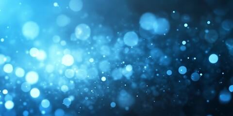 Obraz premium Abstract blue bokeh with shimmering lights creating a dreamy atmosphere.