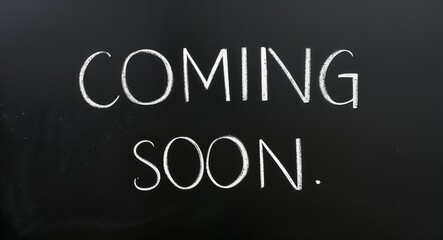 coming soon text lettering on blackboard chalkboard background