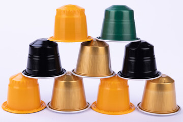 Eye Catching Pyramid of Coffee Capsules on White Surface