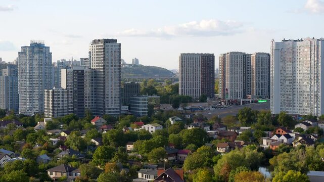 October 8, 2023 - Kyiv, Ukraine: View of Kyiv featuring modern skyscrapers alongside residential areas, illustrating urban expansion and greenery.