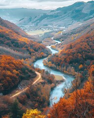 Naklejka premium Panoramic View of Winding River Through Autumn Colored Valley