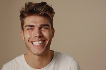 Obraz premium Happy man with white smile after teeth whitening procedure.