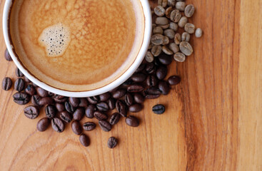 Crema espesso coffee cup, espresso  coffee and coffee bean on wooden table