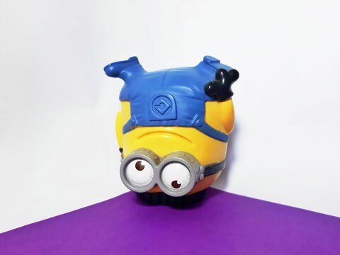 Jakarta, Indonesia July 21, 2023 minion jerry is breakdancing on a white background and purple base 