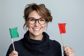 Woman is holding a red flag and a green flag, representing the positive and negative aspects of a relationship