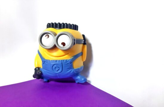 Jakarta, Indonesia July 21, 2023 minion jerry is breakdancing on a white background and purple base 