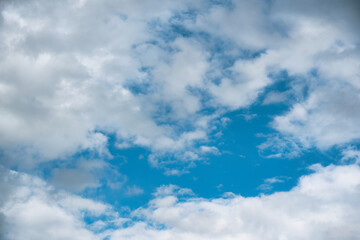 Vibrant blue sky filled with fluffy white clouds