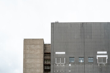 High up view of the decommissioned British-built nuclear power plant. Showing its metal cladding...