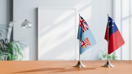 FLAGS OF FIJI AND SAMOA ON TABLE