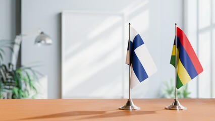 FLAGS OF FINLAND AND MAURITIUS ON TABLE