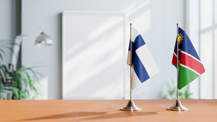 FLAGS OF FINLAND AND NAMIBIA ON TABLE