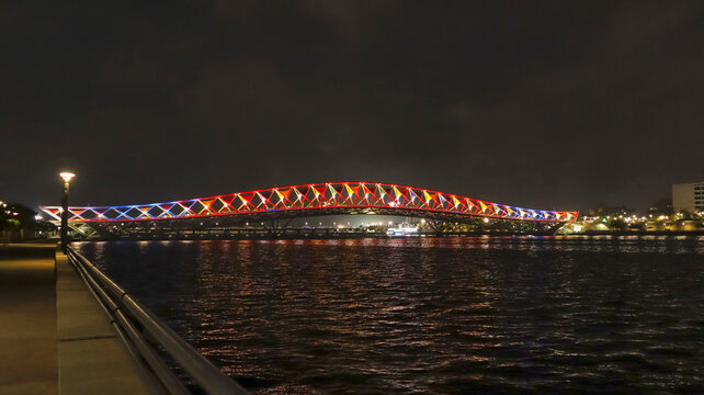 Night view of Atal Bridge with beautiful lights, Sabarmati Riverfront, Ahmedabad, Gujarat, India.