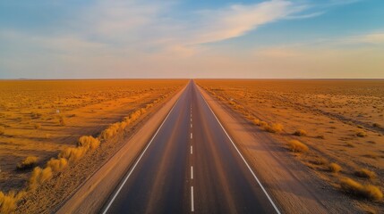 Naklejka premium Endless Desert Road Leading to the Rising Sun