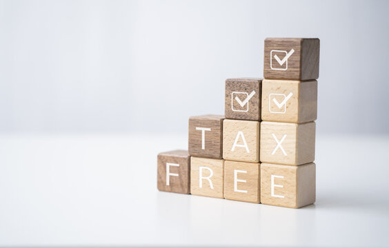 Wooden block tax free financial security bonds, check tax payment earning tax return income and expenses for individuals and business increase spending or investing for economy, with graphics icon