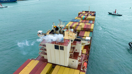 Smoke exhaust gas emissions carbondioxide from cargo lagre ship container ship,Marine diesel engine...