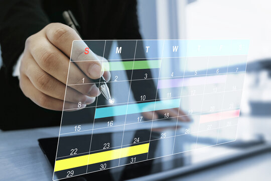 Calendar work schedule, business plan concept.Managing a scheduled meeting.Businessman manages time to work efficiently and on time on all projects.