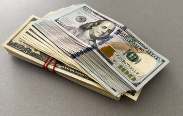 Stack of hundred dollars isolated on white