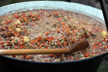 Vegetables and goulash in a goulash pot