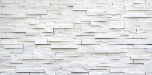 Obraz premium A stylish white stone wall featuring a modern, textured design, perfect for backgrounds and interior decoration.