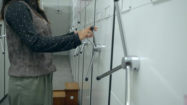 at office storage woman spin handle to move cabinets at the archive Metal Mobile Archive Cabinet Manual mobile shelving is controlled by hand wheel	