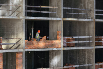 Silhouette Workers under Building Construction