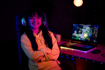 Photo of cute lovely girl crossed hands confident play gamer laptop computer game late night indoors house late