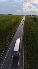 a truck is driving on the road view from a drone