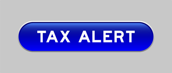 Blue color capsule shape button with word tax alert on gray background