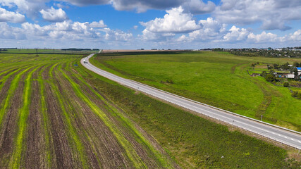 the car is driving along a beautiful road