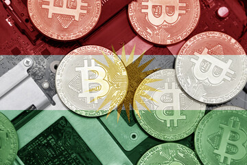 flag of kurdistan on the bitcoins with computer electronic circuit board background. bitcoin...