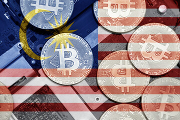 flag of malaysia on the bitcoins with computer electronic circuit board background. bitcoin concept.