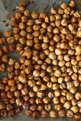Sheet pan with homemade roasted chickpeas. Top view.